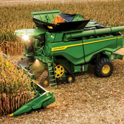 A John Deere X Series combine harvesting corn